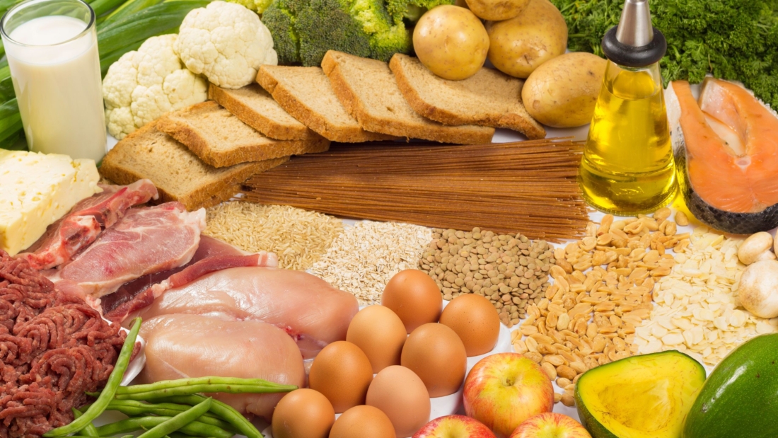 Groceries with eggs, fish, meat, bread, grains and vegetables
