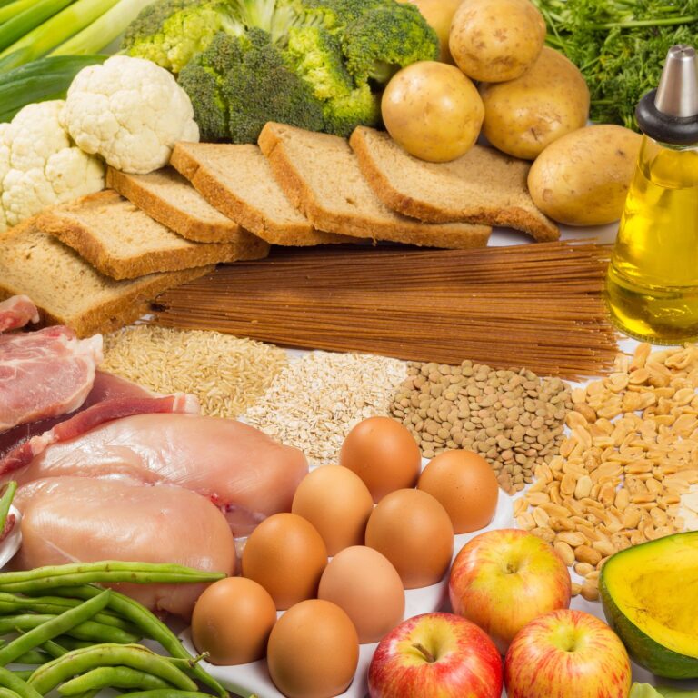 Groceries with eggs, fish, meat, bread, grains and vegetables